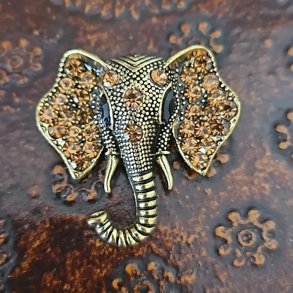 NWOT Gold tone crystal elephant brooch.